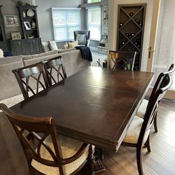 Kitchen table with six chairs and two counter heights stools