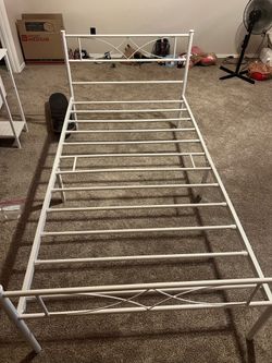 White metal twin bed