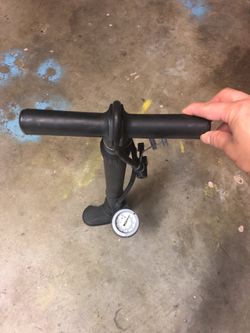 Manual tire pump for bikes wire needle and other attachments
