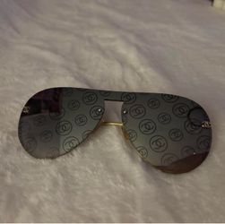 Chanel sunglasses with repeating Chanel logo