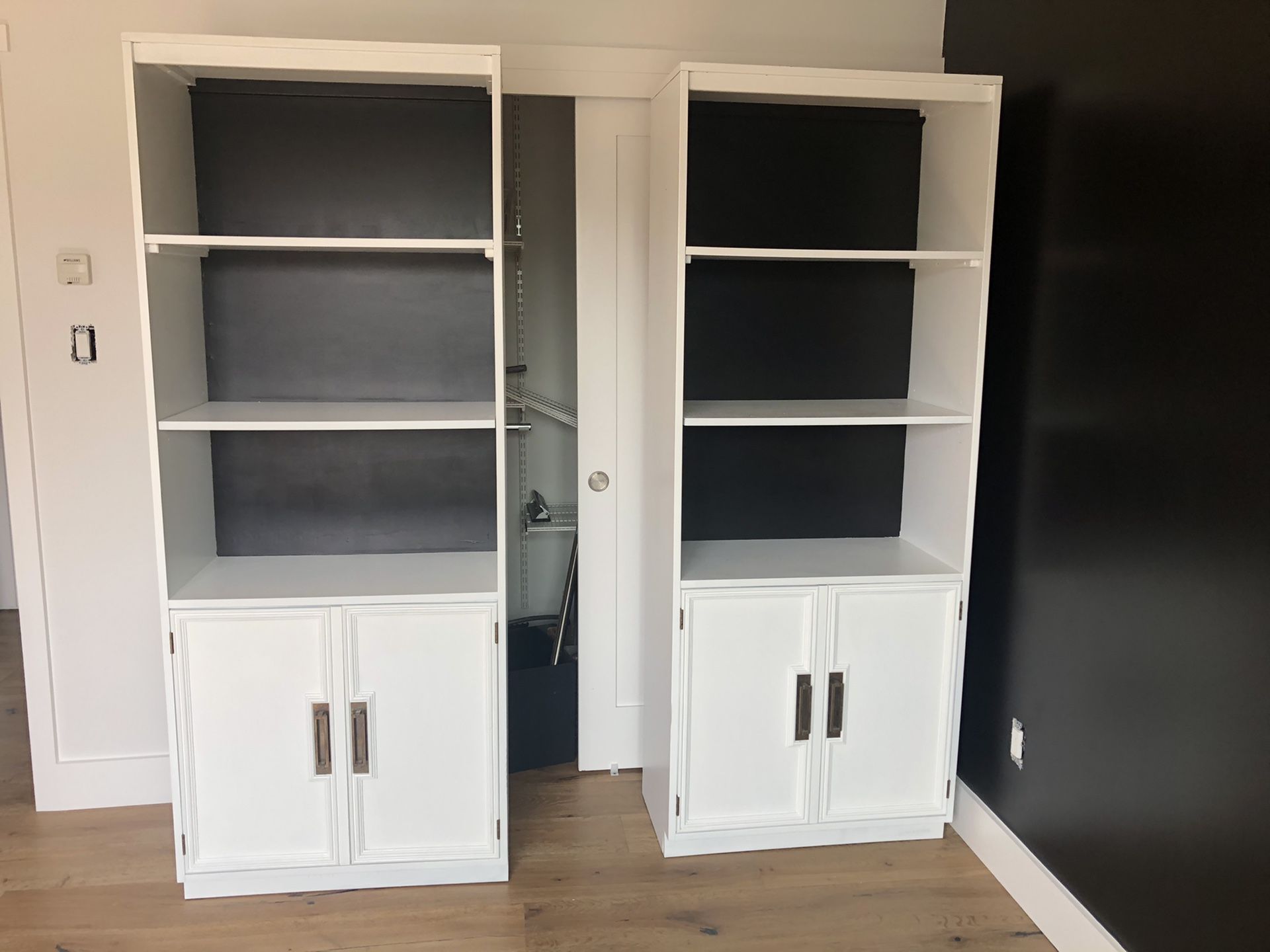 Set of refinished vintage bookshelves with base cabinets.