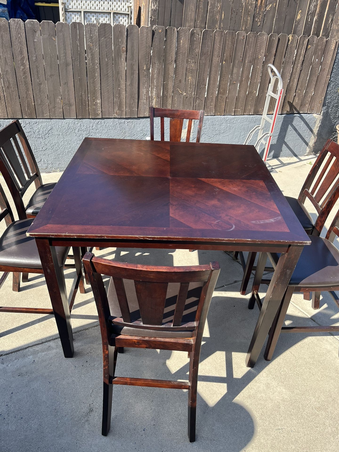 dark wood counter-height dining table and 6 chairs set. Size Table 36” H And Chair 24” H