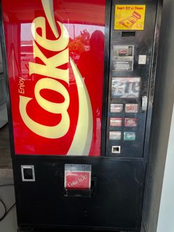 Dixie-Narco Inc. 12 oz. Can & 10 oz. Bottle vending machine.