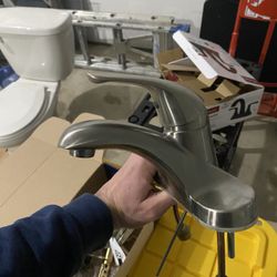 Single-handle, low-arc bathroom faucet in a brushed nickel finish