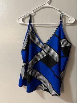 Top With a geometric of blue, white and black stripes.