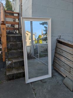 Tall mirror with painted wood frame