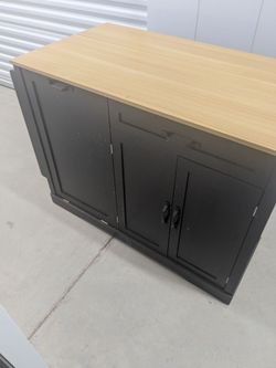Kitchen island with hideaway trash area