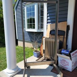 53x23 New Metal Tubing Garment On Heavy Duty  Wheel , Custom Made For Me.