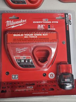 Brand new Milwaukee M12 2.0 battery with battery charger