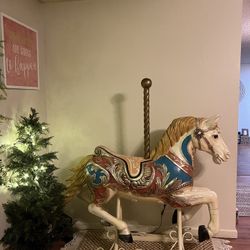 Fancy carousel style decorator horse on an iron scroll base