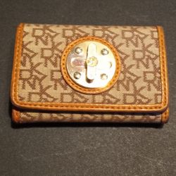 Vintage DKNY (Donna Karan New York) monogrammed wallet with gold-tone hardware