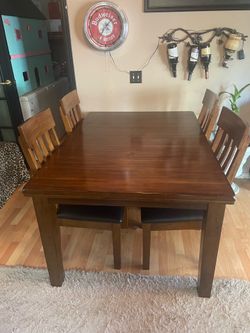 Large dining room table with four chairs￼