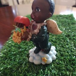 Boy Angel Holding A Heart Filled With Stars 