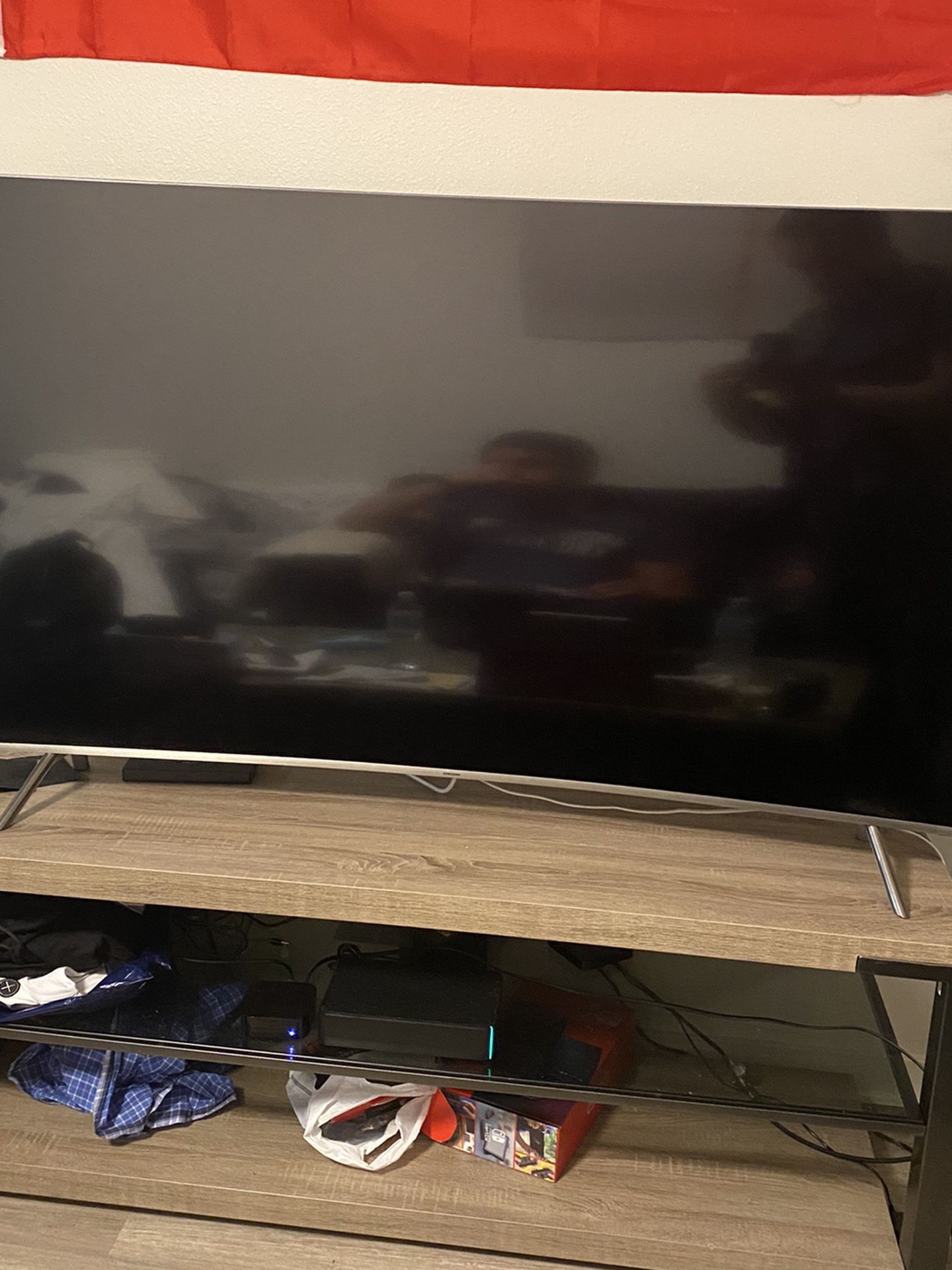 Samsung 65 inch Curved Smart TV 4K with its Stand.