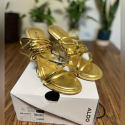 Aldo’s Bamba Gold Strapped Heels