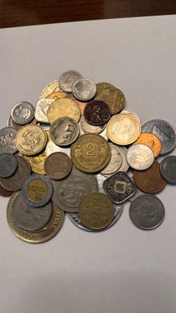 53 coins from around the world  dates on the coins for the 1920s to the 1990s