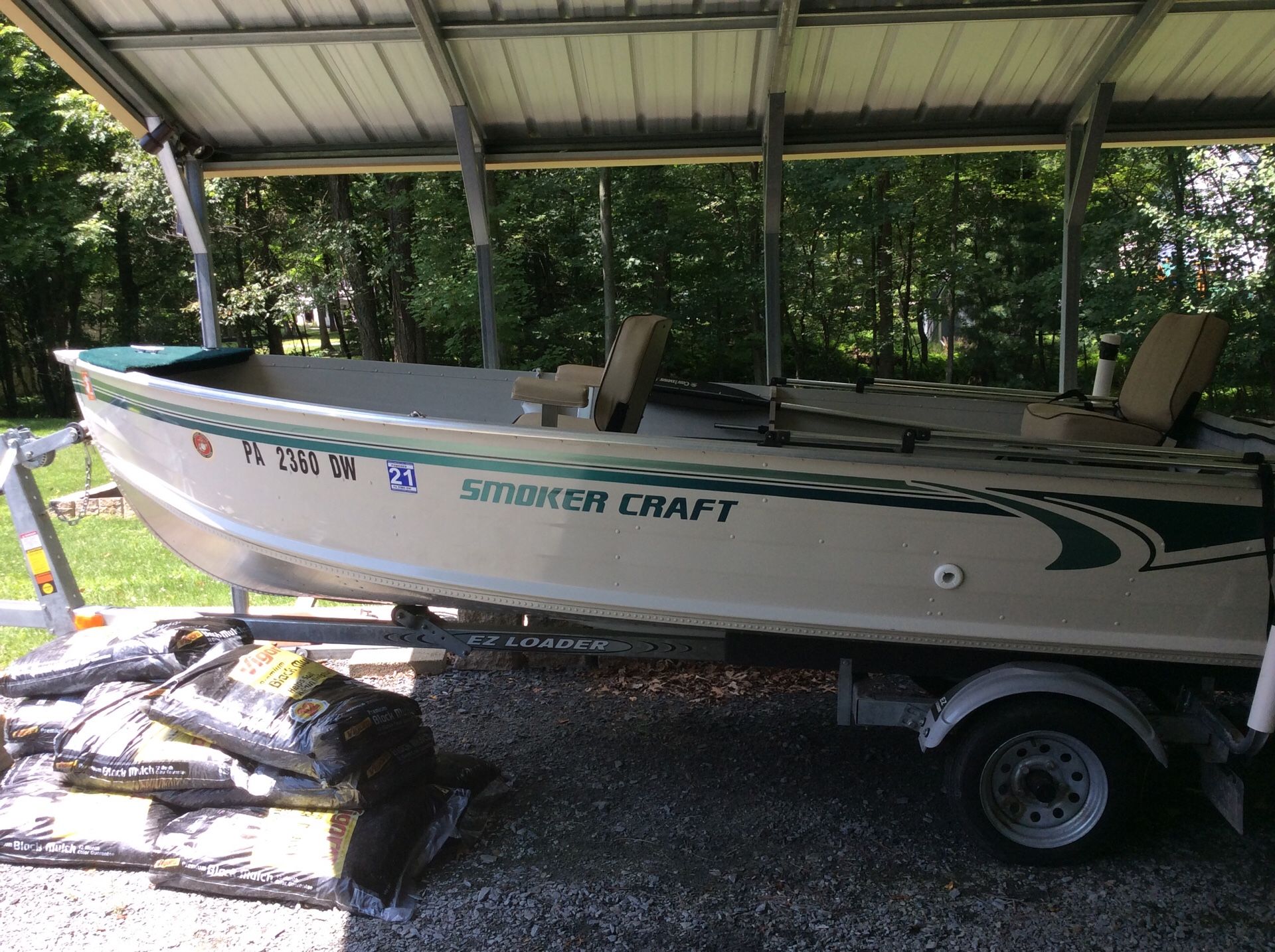 16 foot smoker craft with 9 .9 Mercury engine new trailer live bait