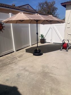 13’by6.5’ oblong beige umbrella with led solar lights