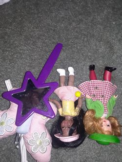 Two small dolls , mirror and butterfly