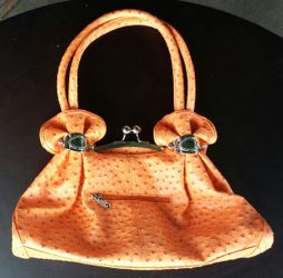 Orange and Chrome handbag. Barely used, clean.