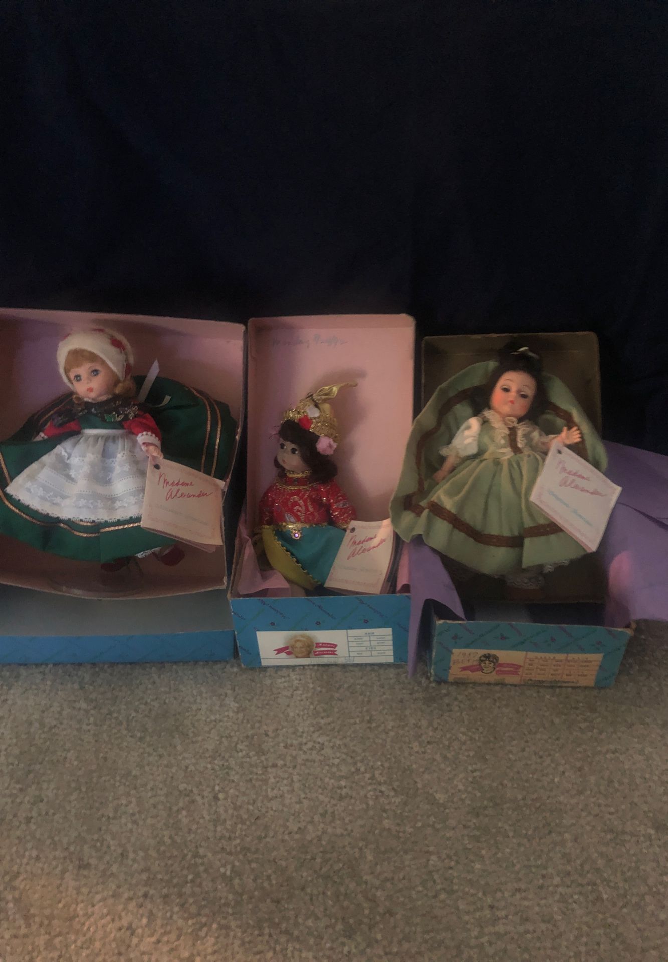 3 Madame Alexander dolls, left to right “Etsy-Denmark, original box # 2 MAlexander-Thailand,3, Madame Alexander-Beth. All are Miniature Showcase