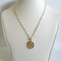 Gold tone pendant necklace with rhinestone details 
