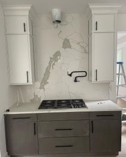 Two Toned Cabinetry with beautiful Slim Shaker Doors. It was a simple white & gray kitchen.