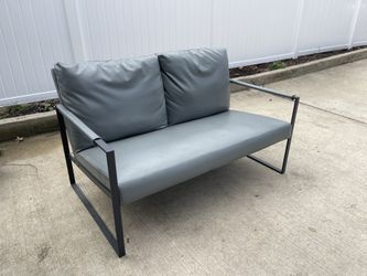 Grey leather office sitting couch