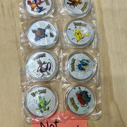 Set Of (8) Pokemon Collectors Coins.  NOT SILVER! 