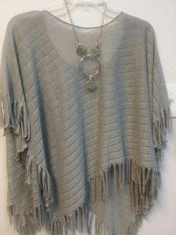 Grey fringe poncho with silver necklace