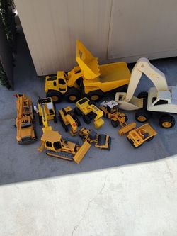Lot of Construction Toy Vehicles , Monster Trucks, and wooden  construction  signs .