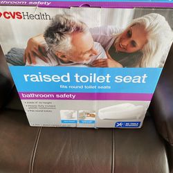 Raised toilet seat