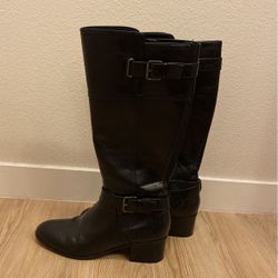 Tall black riding boots