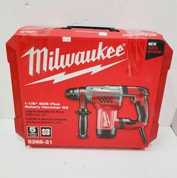 Milwaukee rotary hammer kit features an 8-amp motor and delivers 3.6 ft-lbs of impact energy. This red and black corded tool has a 3-mode operation in