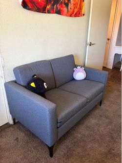 Grey small loveseat / sofa / couch