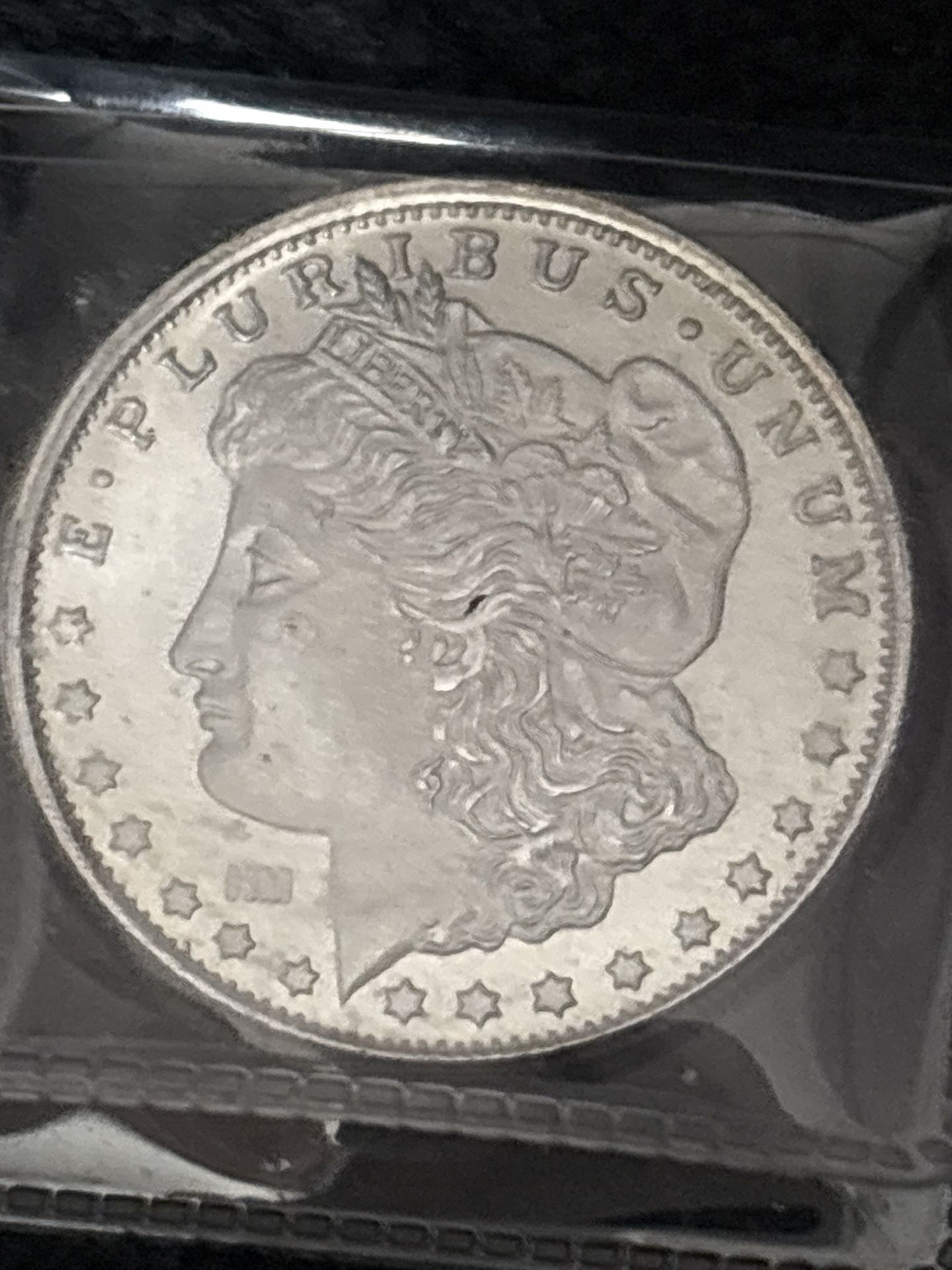 Morgan Silver Dollar Coin round below spot