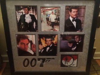 Autographed 007 picture six actors autographed. Playboy mansion peace with papers