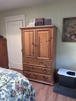Armoire with storage and shelves, can be used to hold TV