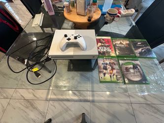 Xbox One S 1 TB with controller, games, stand, and Ferrari Wheel
