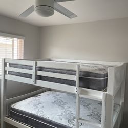 Full over Full bunk bed. Dark walnut,grey & white-$499. Full mattresses -$125.00 each. Assembly not included. Taxes included. Free delivery.  Se habla