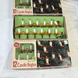 Three lots of candle and holder Christmas tree lights there are 12 lights in each box for a total of 36 lights