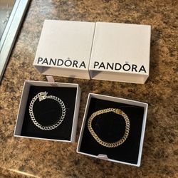 Gold and silver Pandora bracelets