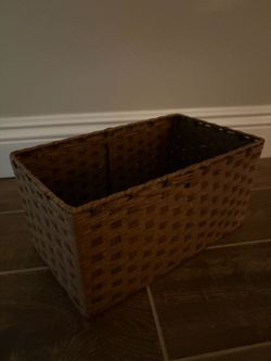 brown woven rectangular storage basket featuring a textured paper-rope pattern