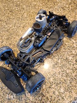 I Think It's TEAM ASSOCIATED 1/12 Nitro With Center Differential 