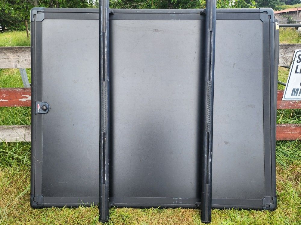 Under cover hard tonneau cover designed for the bed of a Ford F-150