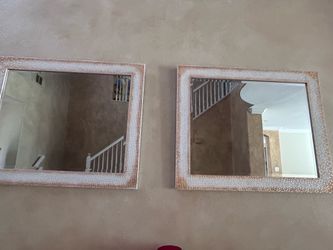 Two golden white mirrors