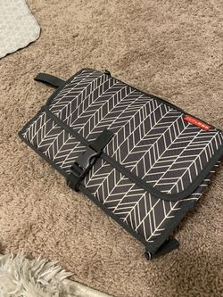 Skip and hop changing station and diaper clutch