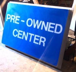 Vintage Automotive 'Pre-Owned Center' signage