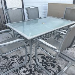 Outside Patio Table with 6 matching chairs- $99.999 READ Description
