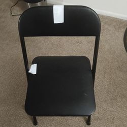2 black foldable chairs